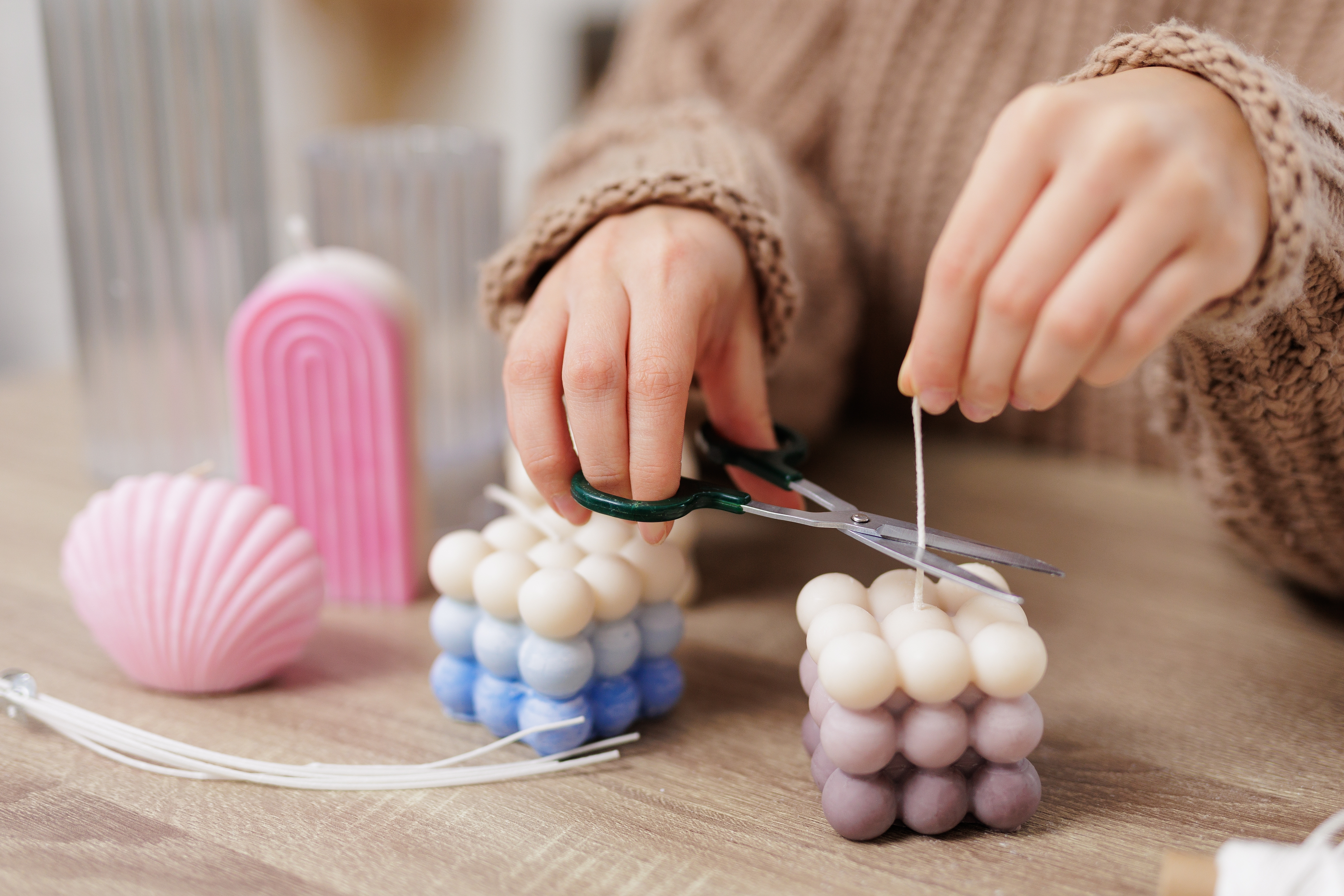 A person making candles